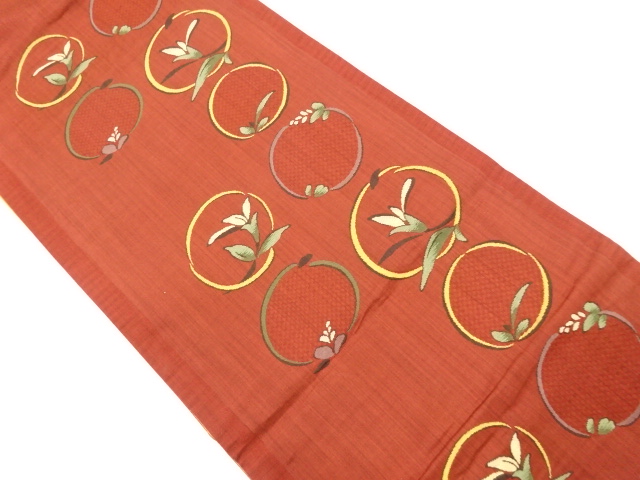 丸に花模様織り出し袋帯